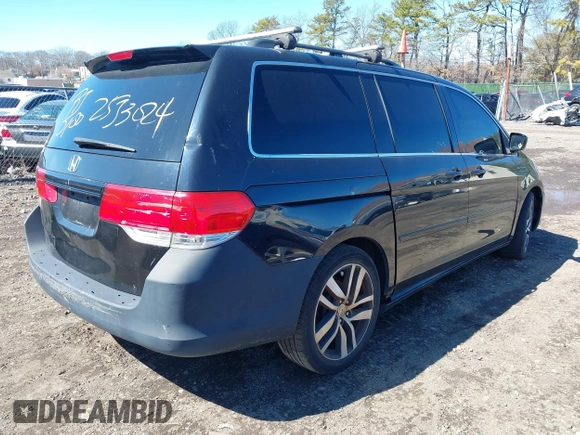 2009 Honda Odyssey EX-L with VIN 5FNRL38759B055396, listed as a IAAI auction lot 41863703 with 999,999 mi miles. Bid and sale history available at carsss.com. Image 4.