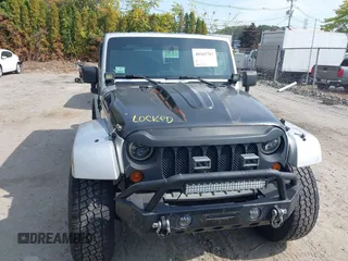 2008 Jeep Wrangler Unlimited Sahara with VIN 1J4GA59158L623784, listed as a IAAI auction lot 40365783 with 185,224 mi miles and . Bid and sale history available at DreamBid. Image 12.