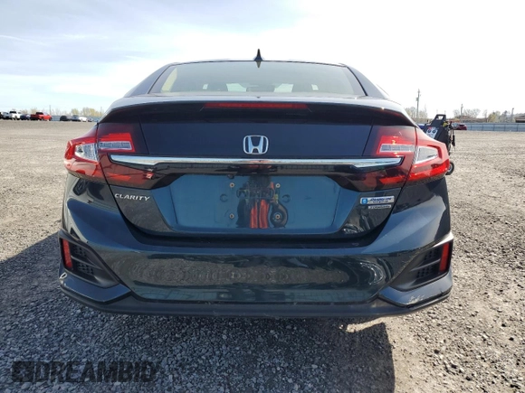 2018 Honda Clarity Touring z VIN JHMZC5F35JC800286, wystawiony jako Copart lot #55320545 z przebiegiem 122 548 mil mil oraz Czysty tytuł • Clean title. Historia ofert i sprzedaży dostępna na DreamBid. Obrazek 6.