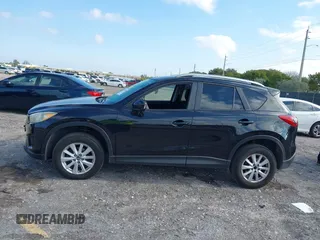 2014 Mazda CX-5 Touring with VIN JM3KE2CYXE0384987, listed as a IAAI auction lot 42052196 with 151,765 mi miles. Bid and sale history available at carsss.com. Image 14.