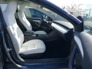 2023 Tesla Model 3 Performance with VIN 5YJ3E1EC4PF705449, listed as a IAAI auction lot 41587026 with 30,292 mi miles. Bid and sale history available at carsss.com. Image 5.