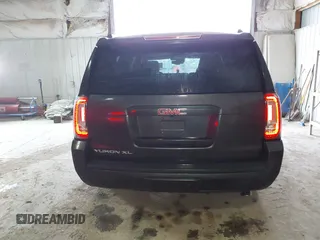 2015 GMC Yukon XL SLT with VIN 1GKS2HKC6FR667110, listed as a IAAI auction lot 41472250 with 141,383 mi miles. Bid and sale history available at carsss.com. Image 16.