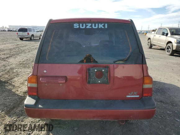 1995 Suzuki Sidekick z VIN JS3TD03V6S4113425, wystawiony jako Copart lot #76973244 z przebiegiem 152 638 mil mil oraz Szkody całkowita. Historia ofert i sprzedaży dostępna na DreamBid. Obrazek 6.
