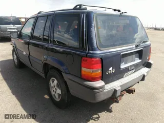 1994 Jeep Grand Cherokee Laredo with VIN 1J4GZ58Y3RC202638, listed as a IAAI auction lot 41885484 with 164,481 mi miles. Bid and sale history available at carsss.com. Image 3.