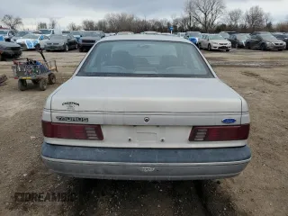 1991 Ford Taurus with VIN 1FACP52U9MG101093, listed as a Copart auction lot 45948105 with 594,696 mi miles and Salvage title. Bid and sale history available at DreamBid. Image 6.