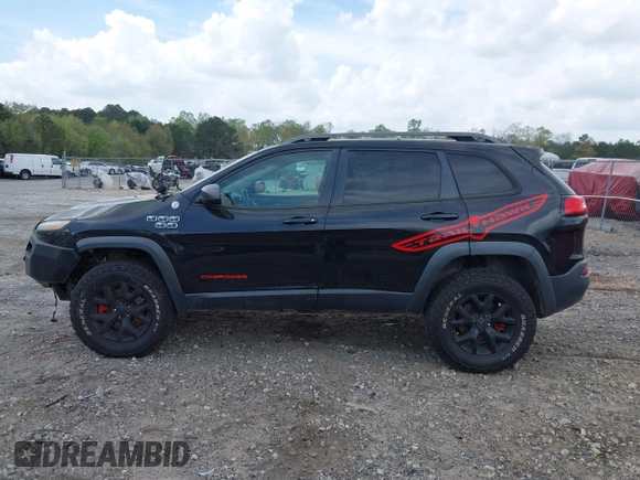 2015 Jeep Cherokee Trailhawk with VIN 1C4PJMBS5FW792184, listed as a IAAI auction lot 41827106 with 132,752 mi miles. Bid and sale history available at carsss.com. Image 14.