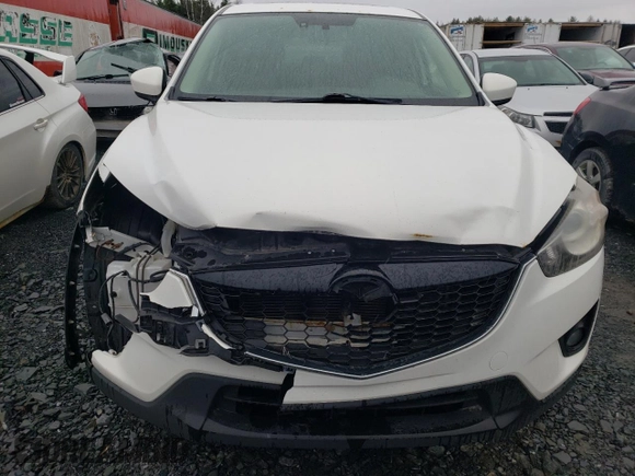 2014 Mazda CX-5 Touring z VIN JM3KE4CY1E0406726, wystawiony jako Copart lot #54652065 z przebiegiem 245 491 mil mil oraz Szkoda całkowita • Salvage title. Historia ofert i sprzedaży dostępna na DreamBid. Obrazek 5.