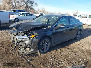 2020 Ford Fusion Hybrid Titanium with VIN 3FA6P0RU9LR141476, listed as a IAAI auction lot 41472921 with 84,433 mi miles. Bid and sale history available at carsss.com. Image 2.
