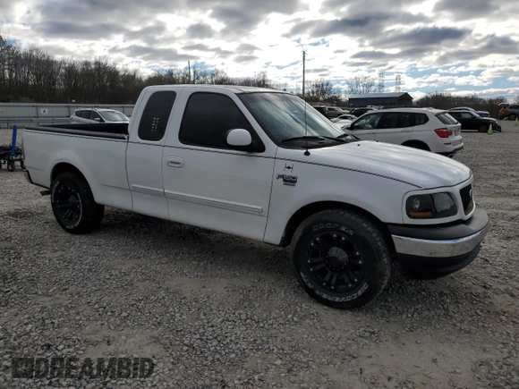 2002 Ford F-150 XL with VIN 1FTRX17W12NA96391, listed as a Copart auction lot 87000064 with 199,867 mi miles and Salvage Title. Bid and sale history available at carsss.com. Image 4.