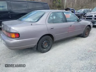 1994 Toyota Camry LE z VIN 4T1SK12E0RU463582, wystawiony jako IAAI lot #41823733 z przebiegiem 120 050 mil mil oraz . Historia ofert i sprzedaży dostępna na DreamBid. Obrazek 4.