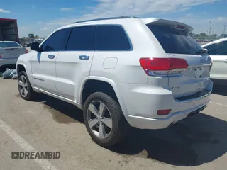 2016 Jeep Grand Cherokee Overland with VIN 1C4RJFCG2GC490420, listed as a IAAI auction lot 42200700 with 97,007 mi miles and . Bid and sale history available at DreamBid. Image 3.