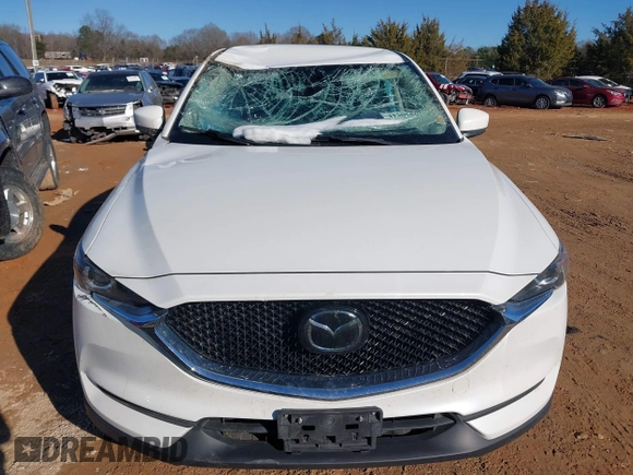 2020 Mazda CX-5 Touring with VIN JM3KFBCM0L0828207, listed as a IAAI auction lot 41305801 with 56,500 mi miles and . Bid and sale history available at DreamBid. Image 12.