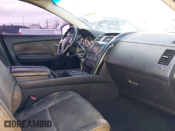 2015 Mazda CX-9 Sport with VIN JM3TB2BAXF0453244, listed as a IAAI auction lot 41905847 with 128,764 mi miles and . Bid and sale history available at carsss.com. Image 5.