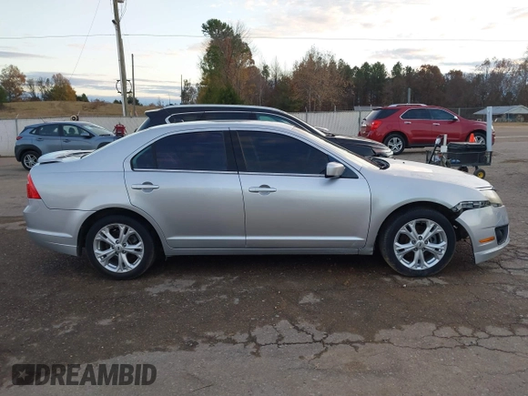 2012 Ford Fusion SE z VIN 3FAHP0HA4CR213409, wystawiony jako IAAI lot #41079155 z przebiegiem 139 129 mil mil oraz . Historia ofert i sprzedaży dostępna na DreamBid. Obrazek 12.
