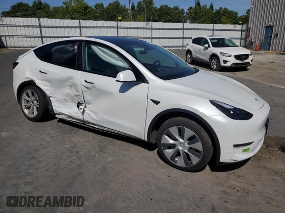 2023 Tesla Model Y Long Range z VIN 7SAYGDEE8PF816544, wystawiony jako Copart lot #57170485 z przebiegiem 74 598 mil mil oraz Szkoda całkowita • Salvage title. Historia ofert i sprzedaży dostępna na DreamBid. Obrazek 4.