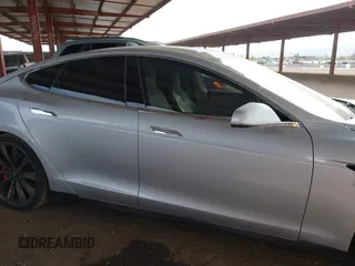 2014 Tesla Model S 60 with VIN 5YJSA1H17EFP35351, listed as a IAAI auction lot 41558434 with 151,002 mi miles and . Bid and sale history available at DreamBid. Image 14.