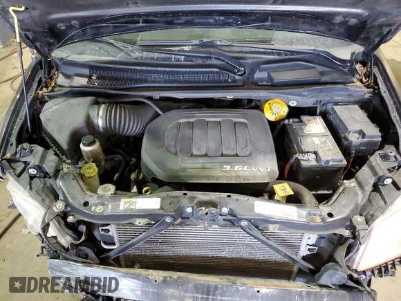 2014 Dodge Grand Caravan SE 30th Anniversary with VIN 2C4RDGBG2ER473684, listed as a Copart auction lot 49076835 with 146,677 mi miles and Clean Title. Bid and sale history available at DreamBid. Image 12.