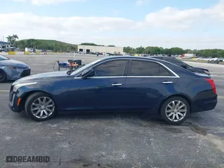 2016 Cadillac CTS Sedan RWD with VIN 1G6AP5SX8G0119984, listed as a IAAI auction lot 42098257 with 98,593 mi miles. Bid and sale history available at carsss.com. Image 14.