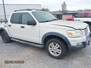 2010 Ford Explorer Sport Trac XLT z VIN 1FMEU3BE3AUA02528, wystawiony jako IAAI lot #41940283 z przebiegiem 96 049 mil mil oraz . Historia ofert i sprzedaży dostępna na DreamBid. Obrazek 1.