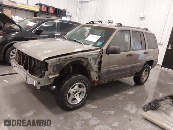1997 Jeep Grand Cherokee Laredo with VIN 1J4GZ58S2VC746778, listed as a IAAI auction lot 41225925 with 196,679 mi miles. Bid and sale history available at carsss.com. Image 18.