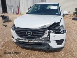 2016 Mazda CX-5 Sport with VIN JM3KE2BYXG0683318, listed as a IAAI auction lot 41777751 with 116,922 mi miles. Bid and sale history available at carsss.com. Image 6.