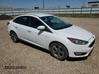2018 Ford Focus SE with VIN 1FADP3FE0JL227146, listed as a Copart auction lot 56151985 with 124,517 mi miles and Salvage title. Bid and sale history available at DreamBid. Image 4.