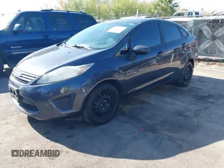 2012 Ford Fiesta S with VIN 3FADP4AJ4CM187553, listed as a IAAI auction lot 41965362 with 136,021 mi miles. Bid and sale history available at carsss.com. Image 2.