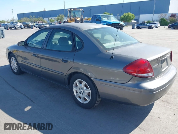 2005 Ford Taurus SE with VIN 1FAFP53U95A289971, listed as a IAAI auction lot 42143134 with 167,702 mi miles. Bid and sale history available at carsss.com. Image 3.
