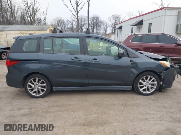 2012 Mazda 5 Touring with VIN JM1CW2CL6C0107233, listed as a IAAI auction lot 41332199 with 130,428 mi miles and . Bid and sale history available at DreamBid. Image 13.