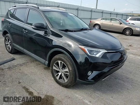 2018 Toyota RAV4 XLE with VIN 2T3WFREV3JW469307, listed as a Copart auction lot 57092295 with 47,639 mi miles and Salvage title. Bid and sale history available at DreamBid. Image 13.