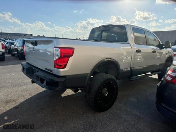 2016 Nissan Titan XD PRO-4X with VIN 1N6BA1F46GN507954, listed as a Copart auction lot 77952834 with 140571 miles and Clean Title. Bid and sale history available at carsss.com. Image 4.