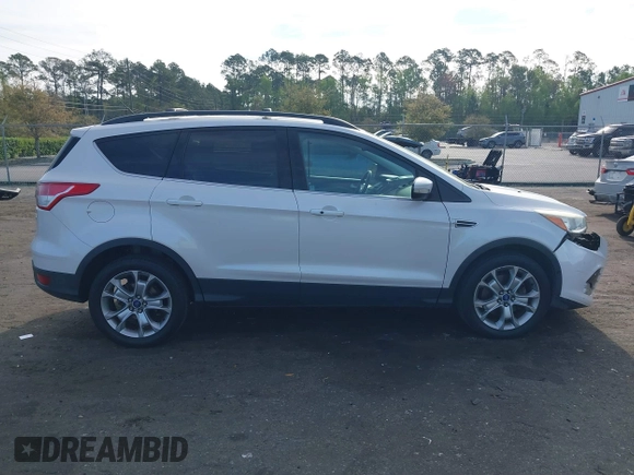 2013 Ford Escape SEL with VIN 1FMCU9H99DUA97959, listed as a IAAI auction lot 41879967 with 149,456 mi miles. Bid and sale history available at carsss.com. Image 13.