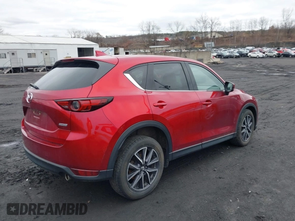 2018 Mazda CX-5 Grand Touring with VIN JM3KFBDM0J0427753, listed as a IAAI auction lot 41740838 with 69,683 mi miles and . Bid and sale history available at DreamBid. Image 4.