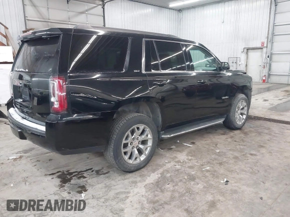 2016 GMC Yukon SLT with VIN 1GKS2BKC9GR176948, listed as a IAAI auction lot 41361221 with 125,178 mi miles. Bid and sale history available at carsss.com. Image 4.