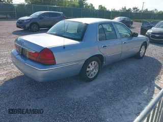 2005 Mercury Grand Marquis LS Premium z VIN 2MEFM75W15X621971, wystawiony jako IAAI lot #42130811 z przebiegiem 129 700 mil mil oraz . Historia ofert i sprzedaży dostępna na DreamBid. Obrazek 4.