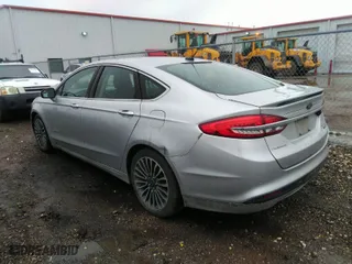 2018 Ford Fusion Hybrid Titanium with VIN 3FA6P0RUXJR207174, listed as a IAAI auction lot 41549400 with 242,901 mi miles. Bid and sale history available at carsss.com. Image 3.