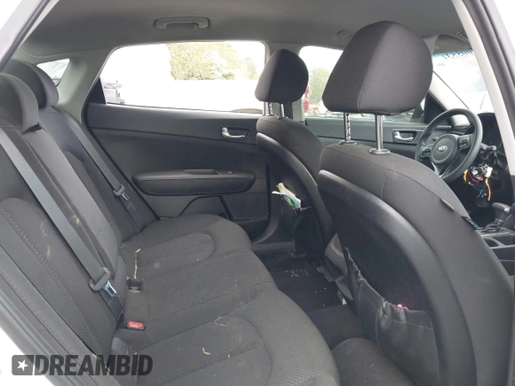 2018 Kia Optima LX with VIN 5XXGT4L30JG256660, listed as a IAAI auction lot 42005531 with 100,337 mi miles and . Bid and sale history available at DreamBid. Image 8.
