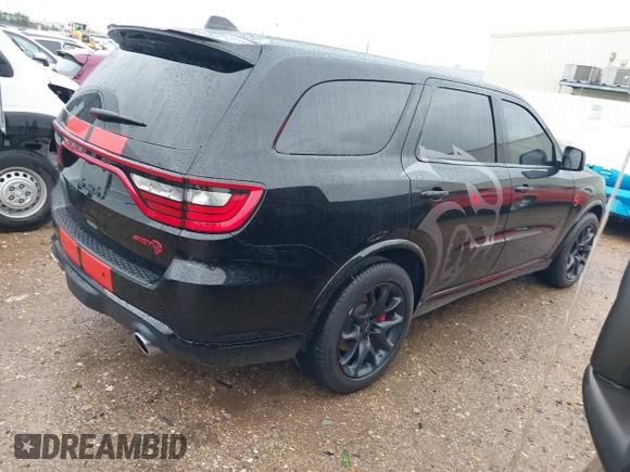 2023 Dodge Durango SRT Hellcat Premium with VIN 1C4SDJH99PC584770, listed as a IAAI auction lot 41562157 with 14,598 mi miles and . Bid and sale history available at DreamBid. Image 4.