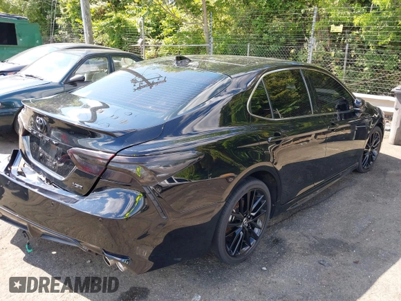 2022 Toyota Camry TRD with VIN 4T1KZ1AK2NU064511, listed as a IAAI auction lot 42176608 with 28,064 mi miles and . Bid and sale history available at DreamBid. Image 4.
