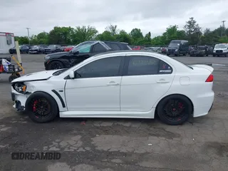 2013 Mitsubishi Lancer Evolution GSR z VIN JA32W8FV0DU023509, wystawiony jako IAAI lot #42222552 z przebiegiem 128 030 mil mil oraz . Historia ofert i sprzedaży dostępna na DreamBid. Obrazek 14.