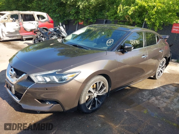 2016 Nissan Maxima Platinum z VIN 1N4AA6AP3GC385276, wystawiony jako IAAI lot #42547410 z przebiegiem 100 307 mil mil oraz . Historia ofert i sprzedaży dostępna na DreamBid. Obrazek 18.