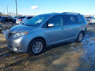 2016 Toyota Sienna XLE with VIN 5TDYK3DC3GS744752, listed as a IAAI auction lot 41077851 with 147,319 mi miles. Bid and sale history available at carsss.com. Image 2.