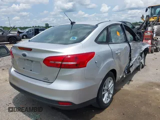 2016 Ford Focus SE with VIN 1FADP3F26GL351775, listed as a IAAI auction lot 42424733 with 164,886 mi miles and . Bid and sale history available at DreamBid. Image 4.