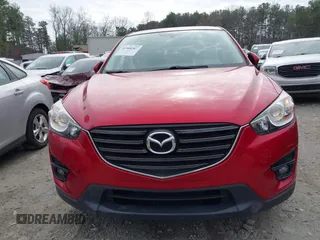 2016 Mazda CX-5 Touring z VIN JM3KE2CY3G0894441, wystawiony jako IAAI lot #41508767 z przebiegiem 88 554 mil mil oraz . Historia ofert i sprzedaży dostępna na DreamBid. Obrazek 12.