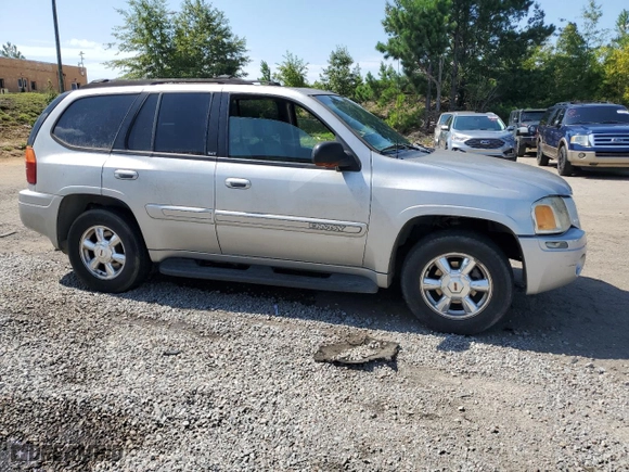 2004 GMC Envoy SLT with VIN 1GKDS13S942193519, listed as a Copart auction lot 84952984 with 156,599 mi miles and Salvage Title. Bid and sale history available at carsss.com. Image 4.