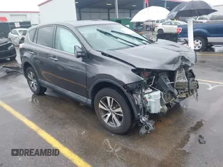 2018 Toyota RAV4 XLE with VIN 2T3RFREV5JW701564, listed as a IAAI auction lot 41976067 with 128,404 mi miles. Bid and sale history available at carsss.com. Image 1.