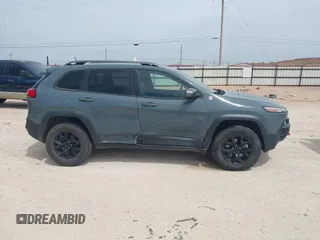 2015 Jeep Cherokee Trailhawk with VIN 1C4PJMBS0FW524479, listed as a IAAI auction lot 41908871 with 118,825 mi miles and . Bid and sale history available at DreamBid. Image 13.