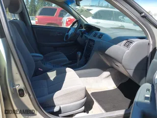 2000 Toyota Camry CE with VIN JT2BG22K6Y0451632, listed as a IAAI auction lot 42030842 with 200,734 mi miles. Bid and sale history available at carsss.com. Image 5.