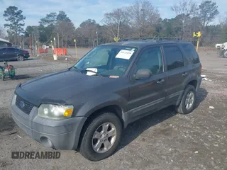 2006 Ford Escape XLT with VIN 1FMYU03Z56KC55074, listed as a IAAI auction lot 41473454 with 164,399 mi miles. Bid and sale history available at carsss.com. Image 6.