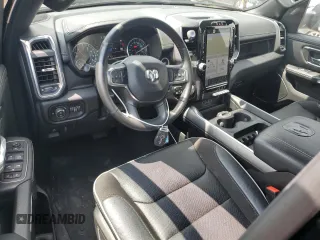 2023 Ram 1500 Laramie with VIN 1C6SRFRT1PN577199, listed as a Copart auction lot 64833895 with 22,119 mi miles and Salvage title. Bid and sale history available at DreamBid. Image 8.